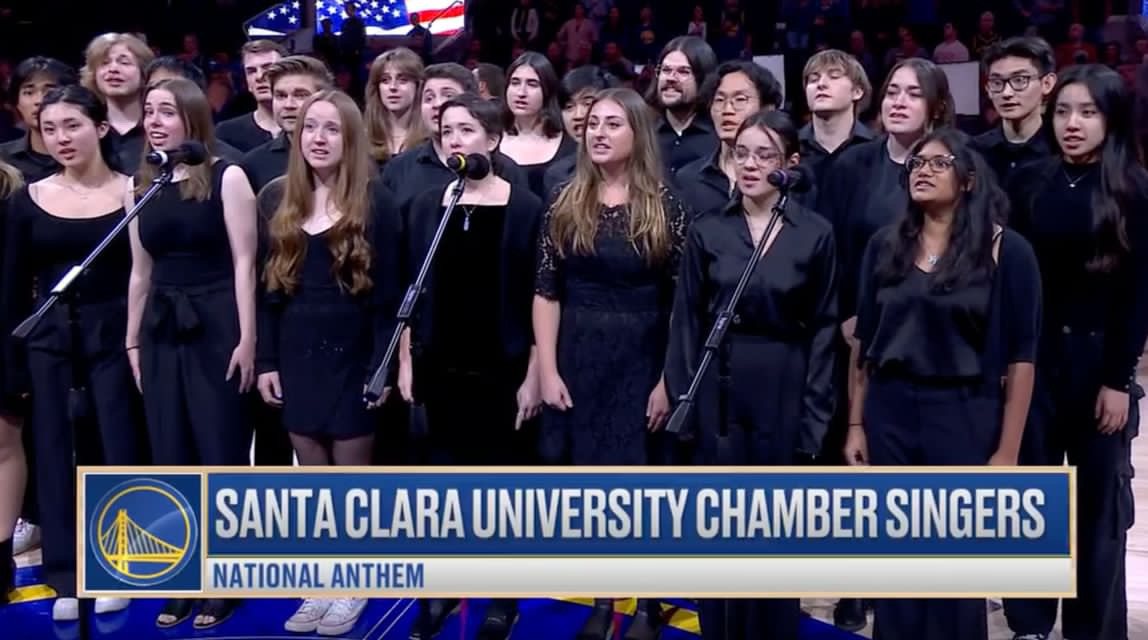 The Santa Clara University Chamber Singers singing the national anthem on the court at a Golden State Warriors game