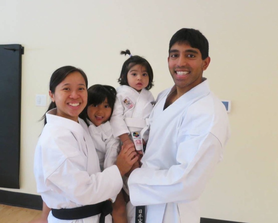 Sensei with his family, all smiling in karate uniforms